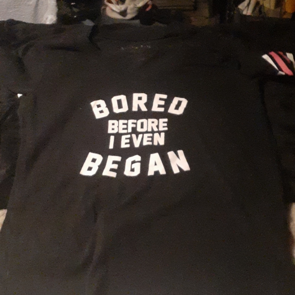 black yshirt with pink and white stripes on sleeve